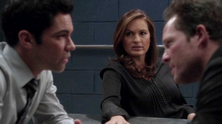 Olivia Benson (Mariska Hargitay) sits between Nick Amaro (Danny Pino) and Brian Cassidy (Dean Winters) in Law & Order: Special Victims Unit