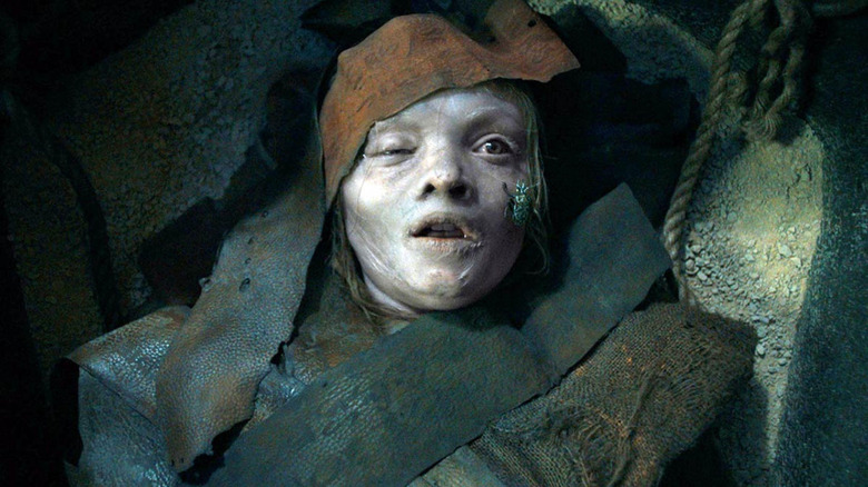 Katie, wrapped in strips of cloth in a sarcophagus in Lee Cronin's The Mummy