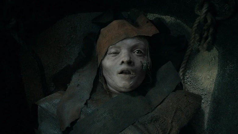 Katie laying in her coffin pale and covered in bandages in Lee Cronin's The Mummy