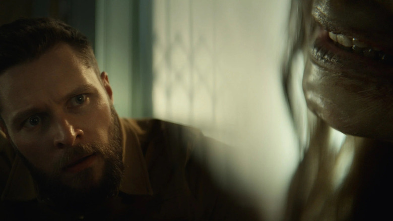 Charlie staring at Katie's mouth in Lee Cronin's The Mummy