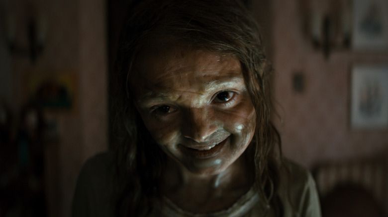 Katie grinning in Lee Cronin's The Mummy