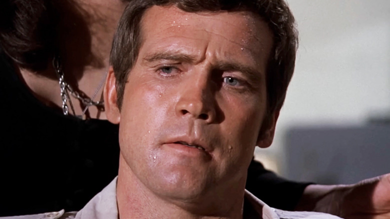 Lee Majors' Steve Austin is seen sweating in closeup in The Six Million Dollar Man