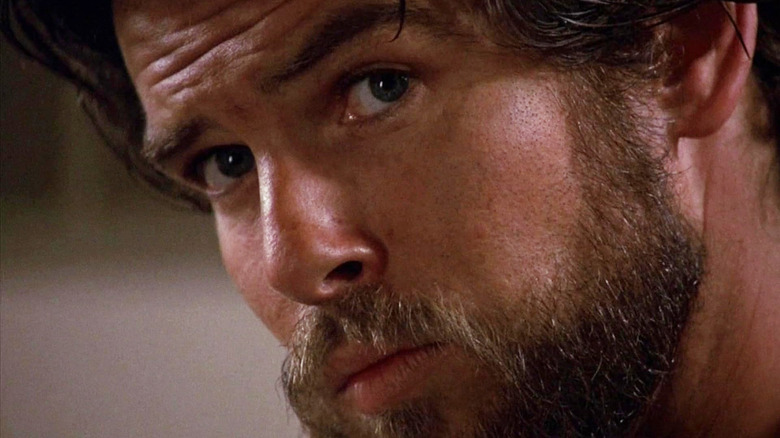 Pierce Brosnan as Jean Charles Pommier looking skeptical (with a bear) in Nomads