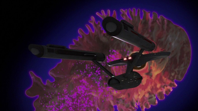 The Enterprise flying into a giant space amoeba on Star Trek