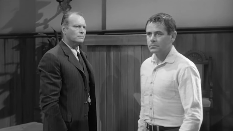 Leif Erickson's Lou Glover watches as Glenn Ford's George Kelby walks away in The Fastest Gun Alive