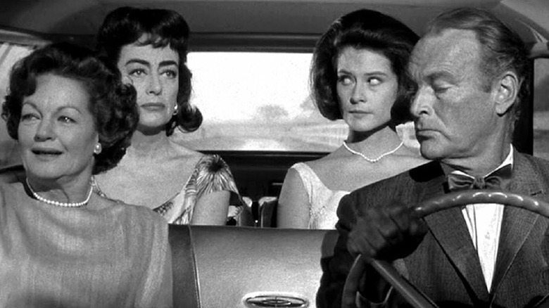 There's side-eying aplenty in the car with Rochelle Hudson as Emily Cutler, Joan Crawford as Lucy Harbin, Diane Baker as Carol Cutler and Leif Erickson as Bill Cutler in Strait-Jacket