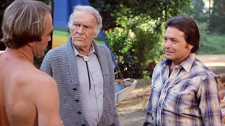 Leif Erickson's Father Prine stands alongside Mickey Gilley's Billy Jo Prine as they look at John Dennis Johnston's Junior Prine in Fantasy Island