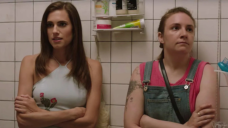 Marnie and Hannah with their arms crossed in the bathroom on Girls
