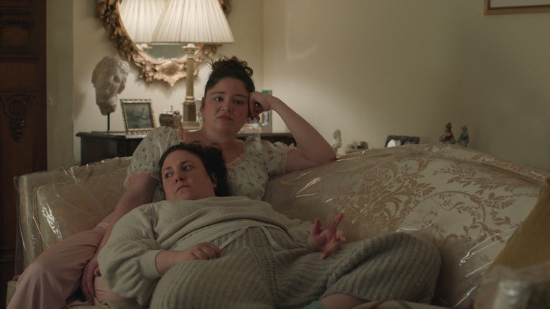 Jess and Nora on the couch both looking upset on Too Much