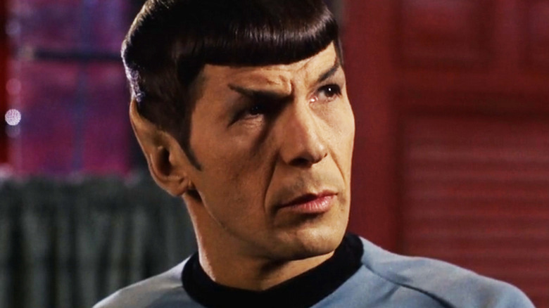 Leonard Nimoy's Spock looks over to his left in Star Trek