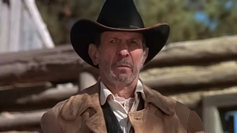 Leonard Nimoy's Frank James stands outside in Bonanza: Under Attack