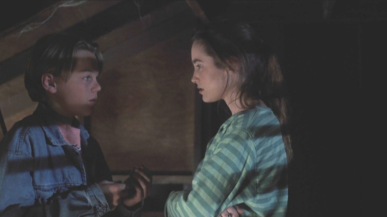 Leonardo DiCaprio as Josh being confronted by Aimee Brooks as Annie in Critters 3