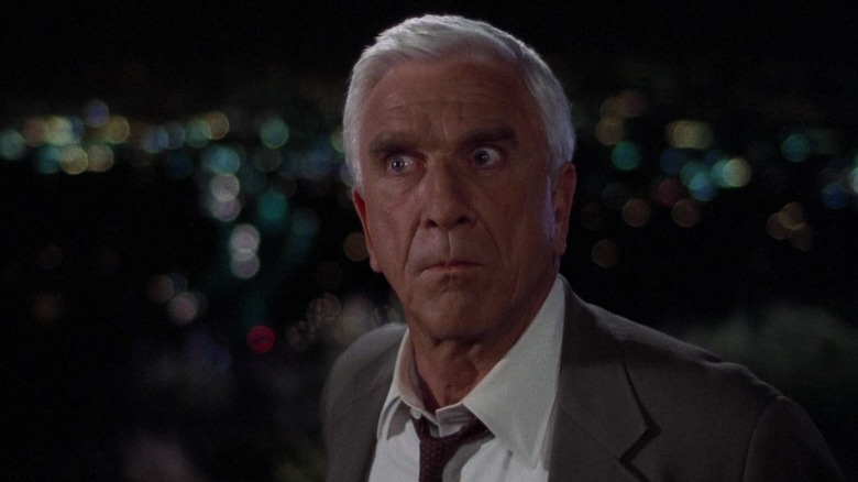 Leslie Nielsen as Lt. Frank Drebin in The Naked Gun  