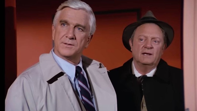 Frank Drebin and Ed Hocken standing in a doorway on "Police Squad!"