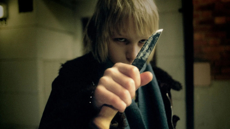 Oskar holding his knife in Let the Right One In