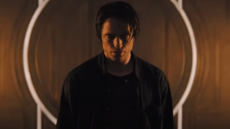 Bruce Wayne in an elevated superhero scene