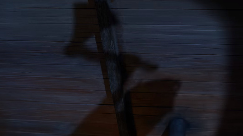 Geppetto creates Pinocchio in Guillermo del Toro's Pinocchio