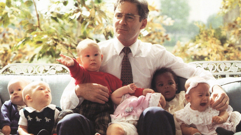 Kevin Kline surrounded by babies in Dave