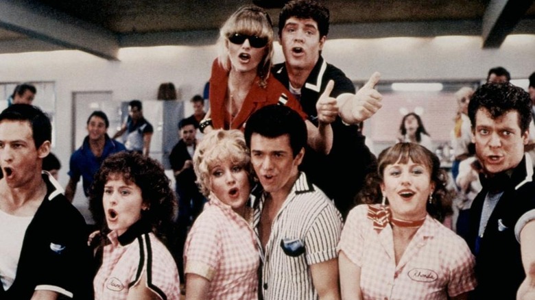 several '50s dressed people singling in a group