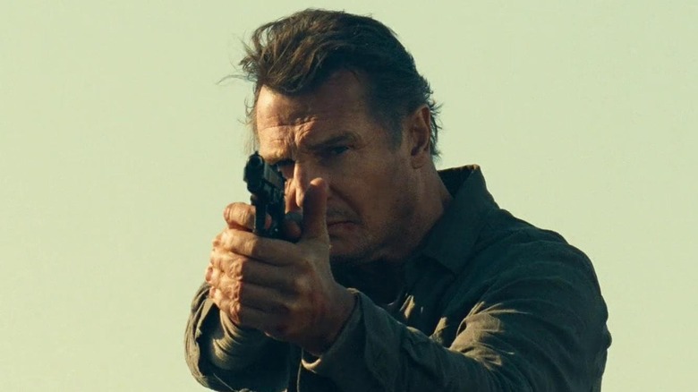 Bryan Mills aiming gun