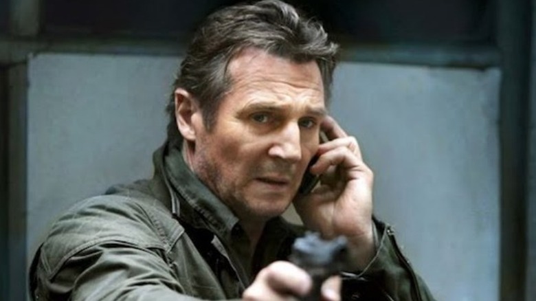 Bryan Mills aiming gun