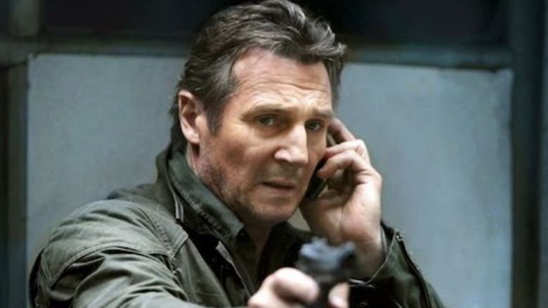 Bryan Mills aiming gun