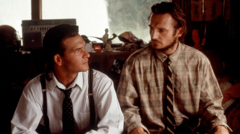 Truman and Briar Gates sitting in an office looking at each other in Next of Kin