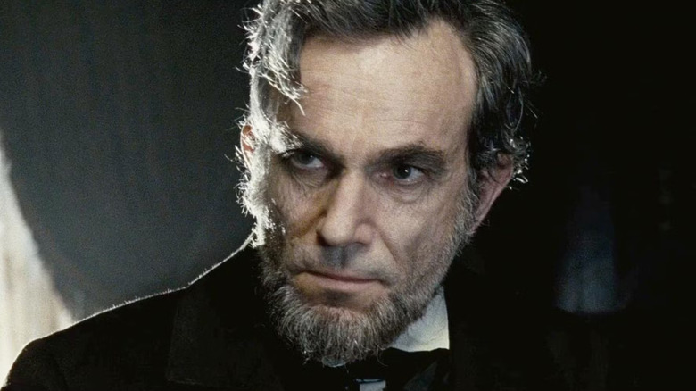 Lincoln (Daniel Day Lewis) is looking intensively in Lincoln