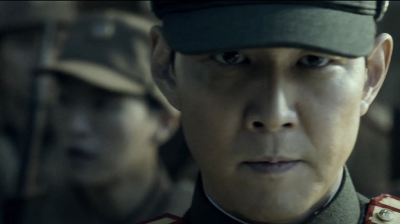 Lee Jung-jae as Jang Hak-soo looks forward in a line of soldiers in Operation Chromite