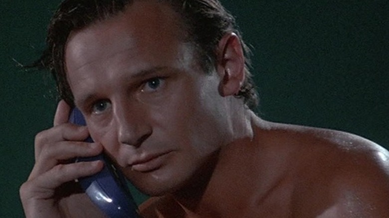 Sean receiving a phone call in an episode of Miami Vice