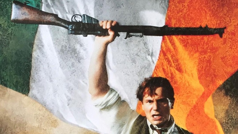 Michael Collins poster - Liam Neeson as Michael Collins holding rifle behind Irish flag
