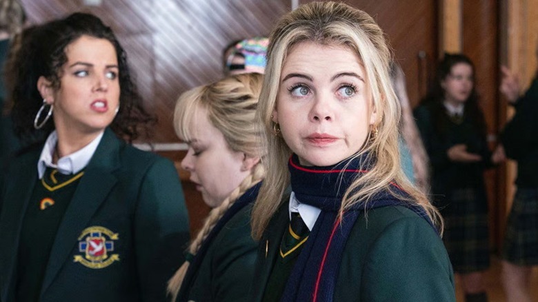 Derry Girls - Michelle, Clare, and Erin walking together