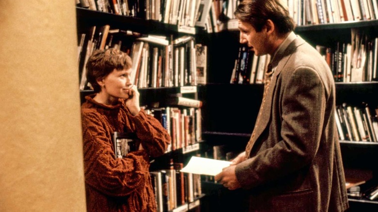 Judy talking to Michael in a library in Husbands & Wives