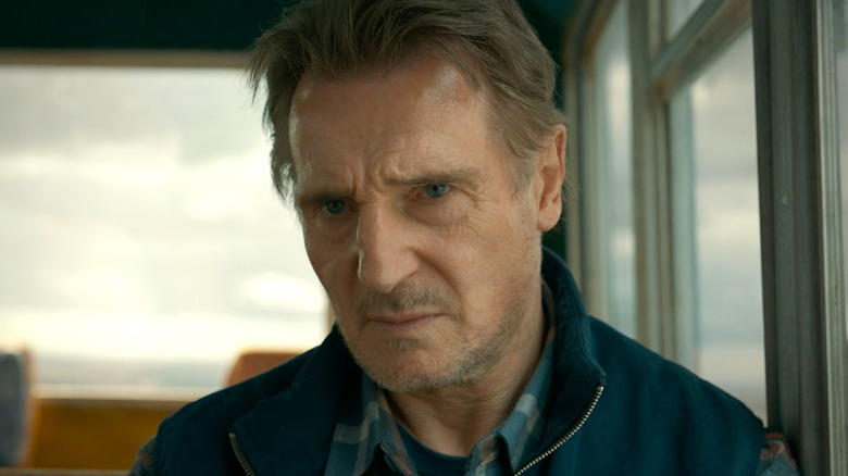 A close up of Mike McCann sitting in a bus in "Ice Road: Vengeance"