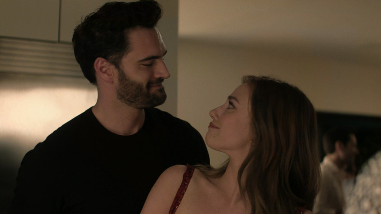 Tom Bateman's Dr. Adam Carlsen looks lovingly into the eyes of Lili Reinhart's Olive Smith in The Love Hypothesis