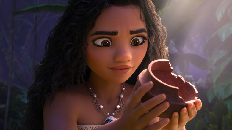 Moana staring at a piece of broken pottery in Moana 2