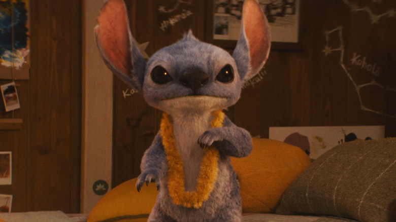 Stitch standing on the bed in Lilo & Stitch (2025)