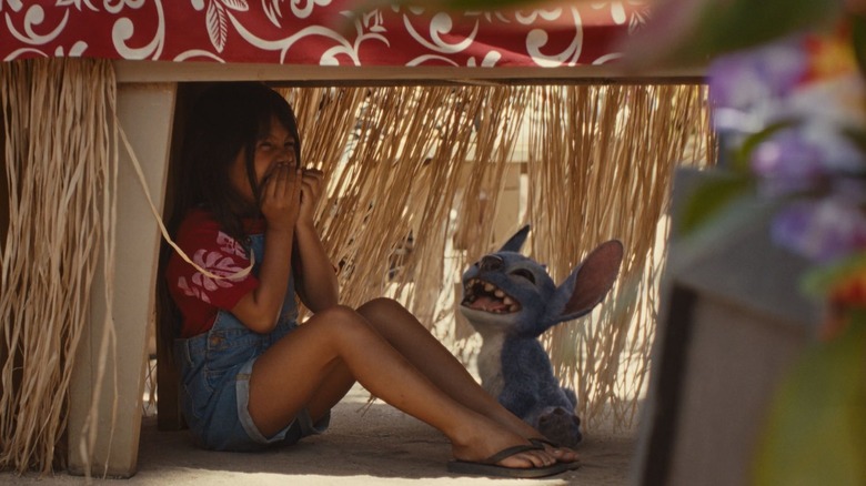 Lilo and Stitch hiding under a table