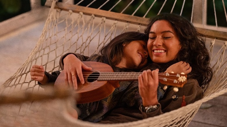 Lilo and Nani in a hammock playing ukulele