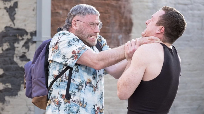 John Travolta as Moose, choking out a man on the street, in The Fanatic