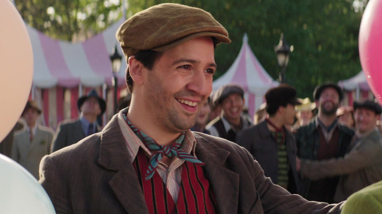 Jack smiling while holding balloons in Mary Poppins Returns