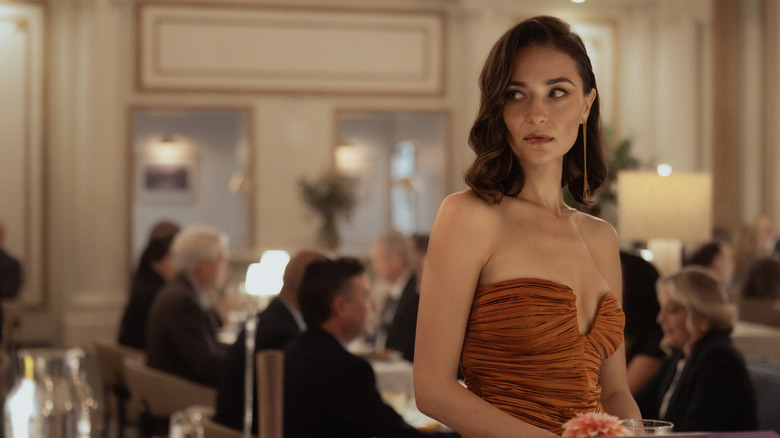 Elizaveta Neretin's Oleksandra Balakin stands in a restaurant in Lioness