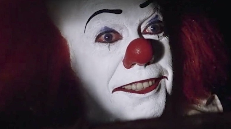 Tim Curry as Pennywise