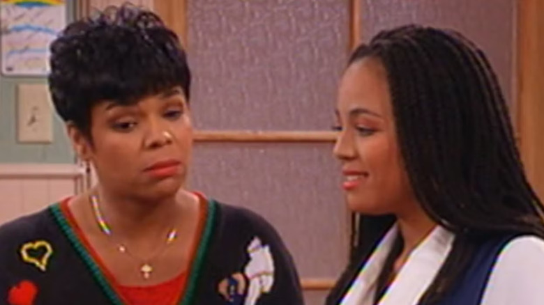 Chip Fields as Laverne Hunter stands next to Kim Fields as Regine Hunter in Living Single.