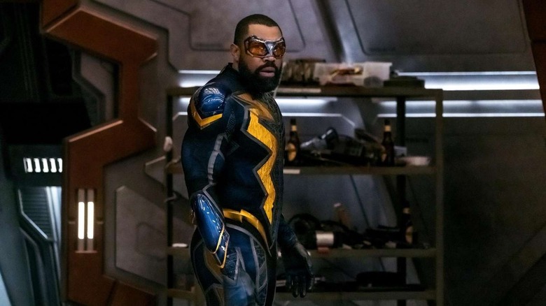 Cress William as Black Lightning stands in costume in Black Lightning.