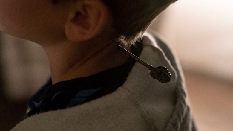 Jackson Robert Scott with key in neck