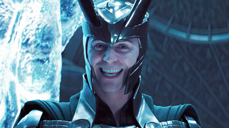 Tom Hiddleston's Loki smiles in closeup in Thor