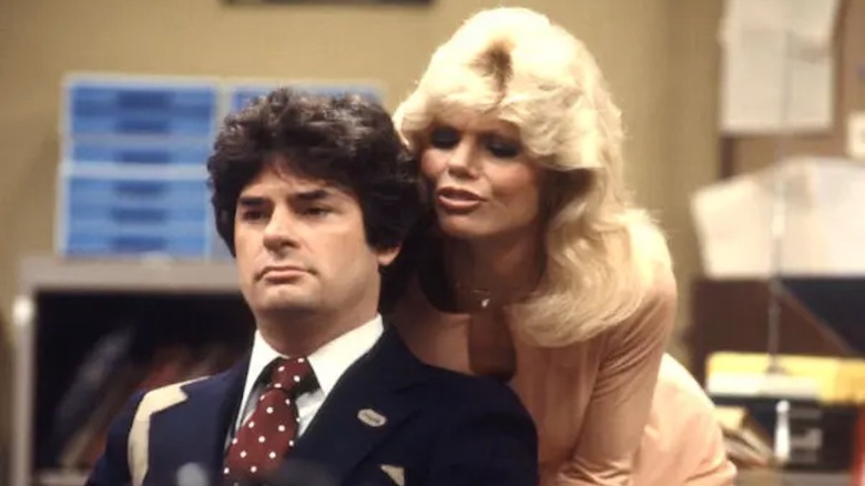 Loni Anderson as Jennifer Marlowe facetiously flirts with Frank Bonner as Herb Tarlek in WKRP in Cincinnati