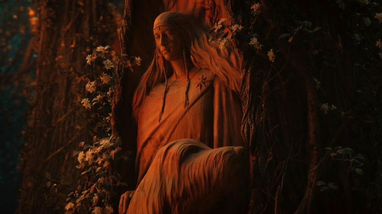 A statue of Lúthien and the talking dog Huan the Hound