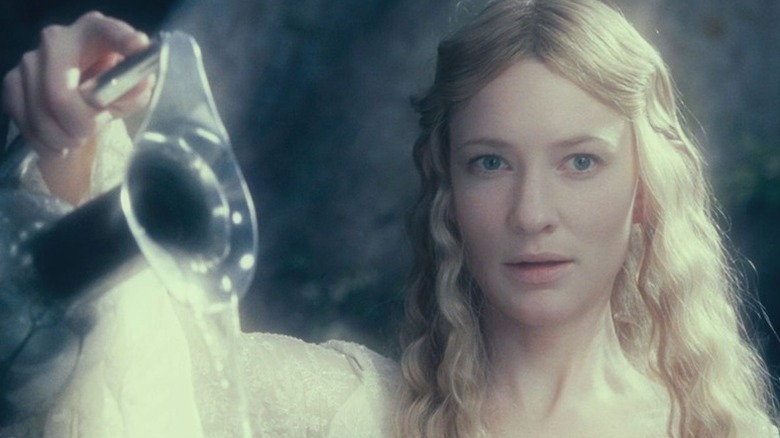 Galadriel (Cate Blanchett) pours water from a silver pitcher in The Lord of the Rings: The Fellowship of the Ring